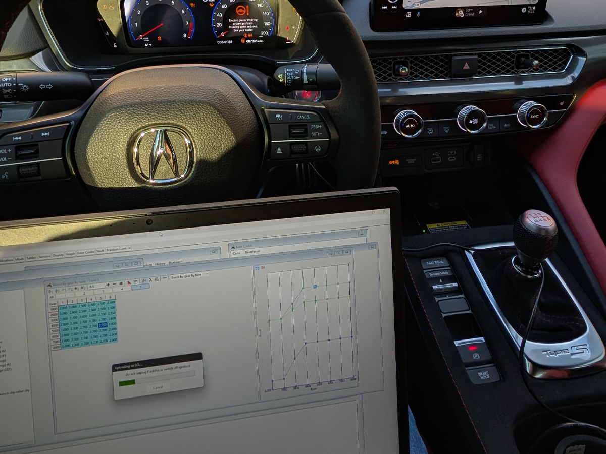 Laptop connected inside an Acura for calibration